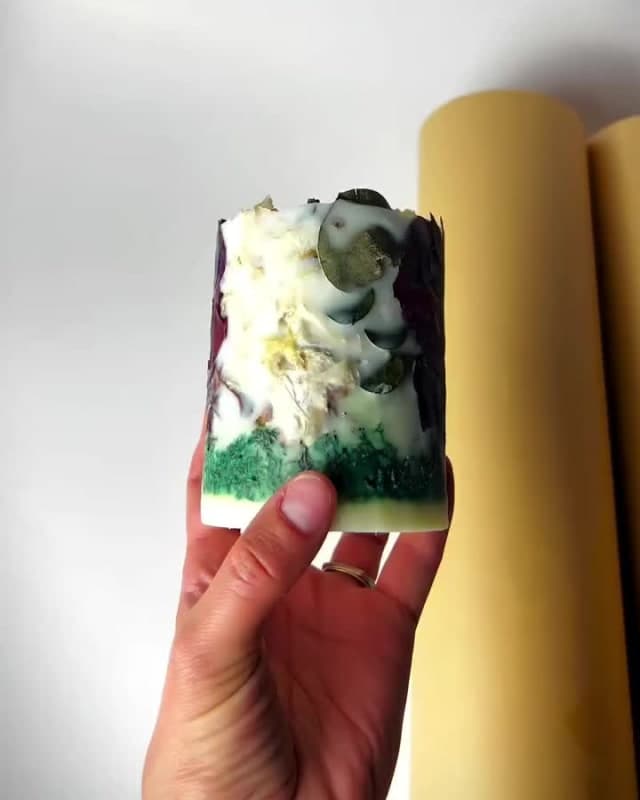 Wrapping a finished candle by hand